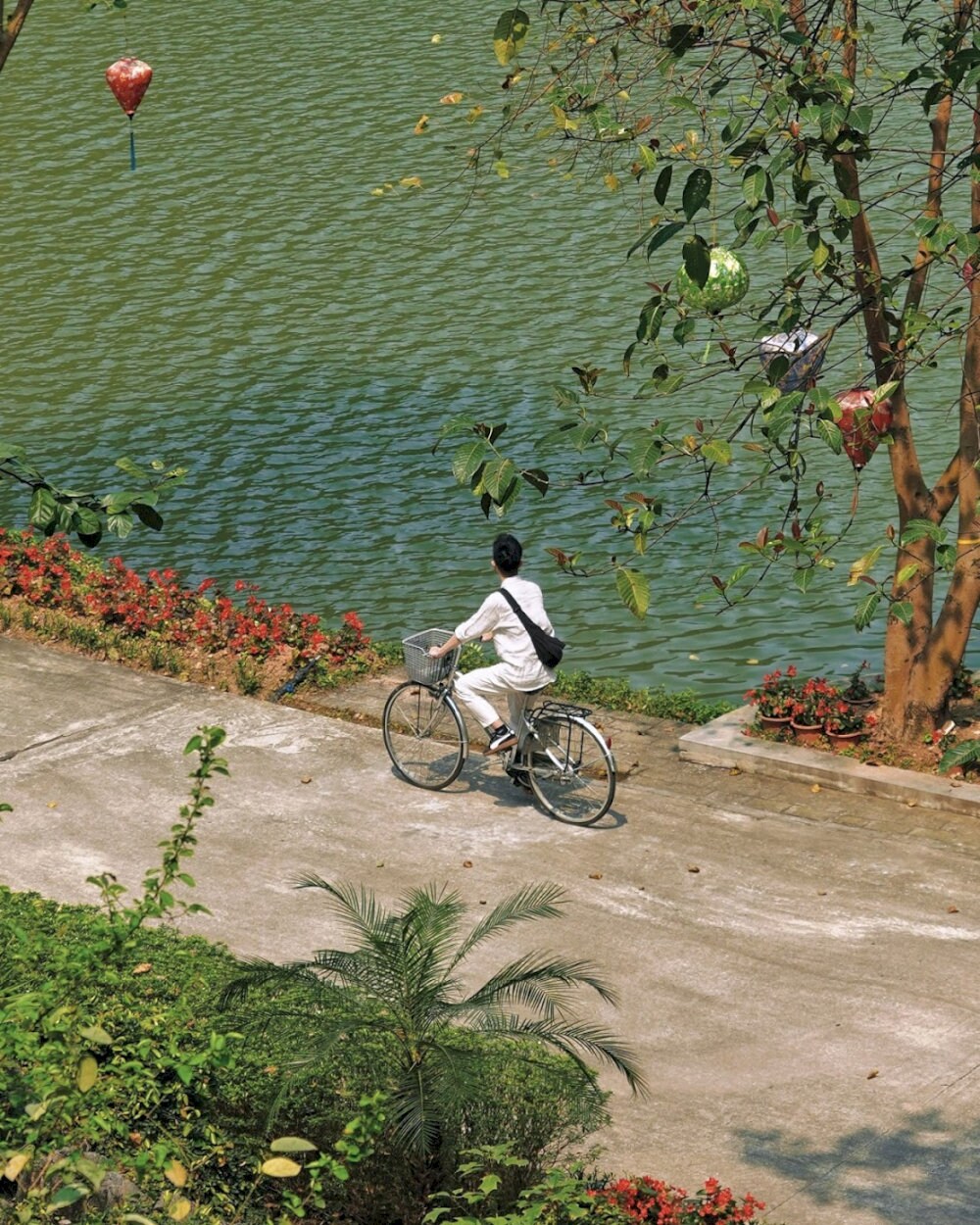 The ride is gentle and scenic, winding past lush greenery and limestone cliffs